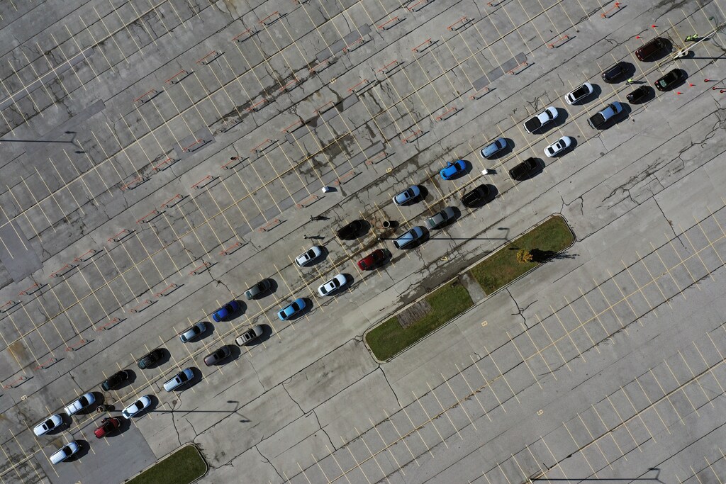 An aerial view of people waiting in their vehicles for COVID-19 tests at a drive-thru testing site in the parking lot of Miller Park as the coronavirus disease outbreak continues in Milwaukee, Wisconsin, U.S., October 21, 2020. Photo taken with a drone. REUTERS/Bing Guan TPX IMAGES OF THE DAY - RC28NJ9AN9P4