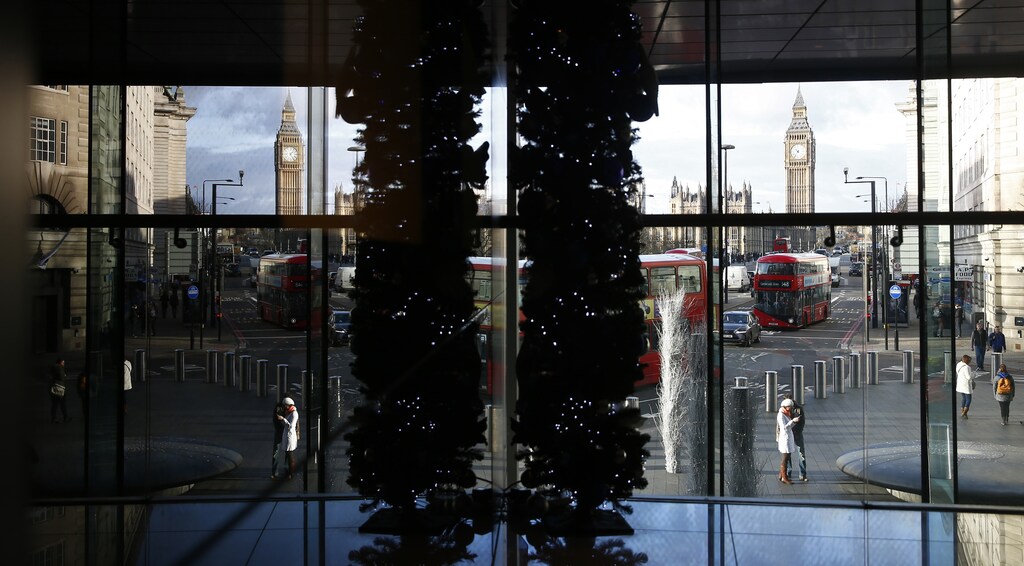 Big Ben and the Houses of Parliament are seen through a window in central London December 23, 2014.