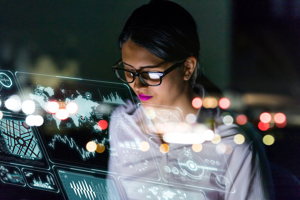 Woman engineer looking at various information in screen of futuristic interface. future workforce