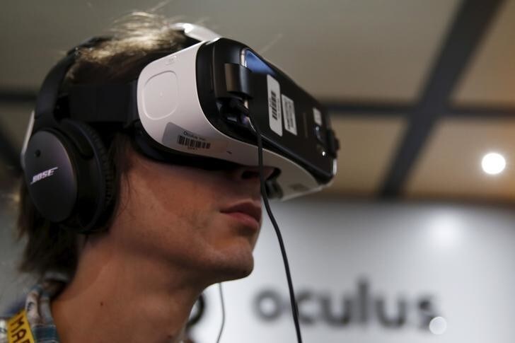 A man wears an Oculus Samsung Gear VR with the Galaxy Note 4 virtual reality headset at the Electronic Entertainment Expo, or E3, in Los Angeles, California, United States, June 17, 2015. Virtual reality gaming, once a distant concept, became the new battleground at this year's E3 industry convention, with developers seeking to win over fans with their immersive headsets and accessories.