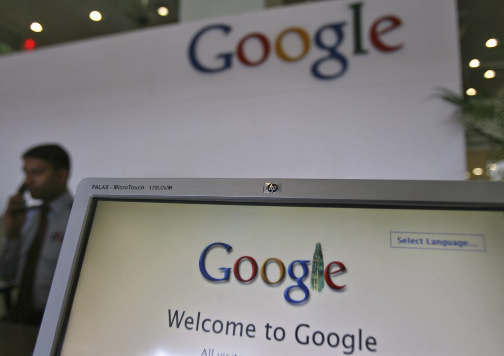 A security personnel answers a call at the reception counter of the Google office in the southern Indian city of Hyderabad February 6, 2012. Internet giants Google Inc and Facebook removed content from some Indian domain websites on Monday following a court directive warning them of a crackdown "like China" if they did not take steps to protect religious sensibilities. REUTERS/Krishnendu Halder (INDIA - Tags: SCIENCE TECHNOLOGY POLITICS BUSINESS) - RTR2XELJ