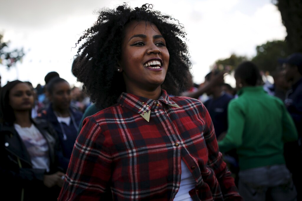 A member of the Ethiopian Jewish community in Israel dances during a ceremony marking the holiday of Sigd in Jerusalem November 11, 2015. Sigd marks the community's longing to return to Jerusalem, where they see their biblical roots REUTERS/ Amir Cohen - GF20000054984