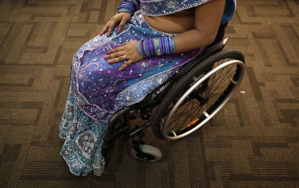 A competitor waits backstage during Miss Wheelchair India, the country's first wheelchair beauty pageant, in Mumbai November 24, 2013. A total of 16 women from all across the India participated in the contest. The organisers hope the pageant will open doors for differently-abled women in the fields of modeling, film, and television. REUTERS/Danish Siddiqui (INDIA - Tags: SOCIETY) - GM1E9BP0ABZ01