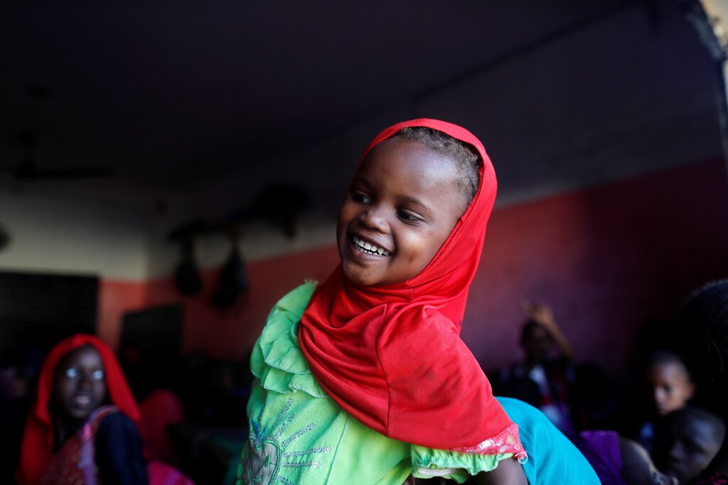 A girl smiles as she attends evening class in Medina neighbourhood, Dakar, Senegal December 11, 2018. REUTERS/Zohra Bensemra - RC18EE61AE70