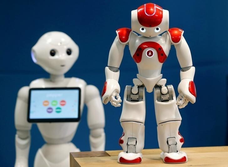 SoftBank Robotics Robot Assistants Pepper (L) and NAO (R) are pictured in Paris, France, March 9, 2018. Picture taken March 9, 2018. REUTERS/Regis Duvignau