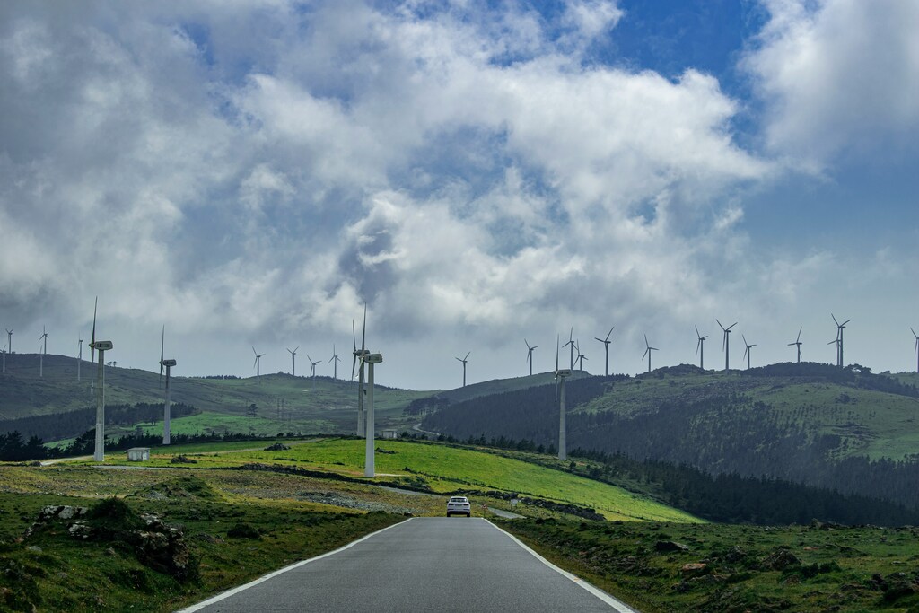 Wind turbines in Galicia, Spain, where community engagement could manage opposition to renewable projects.