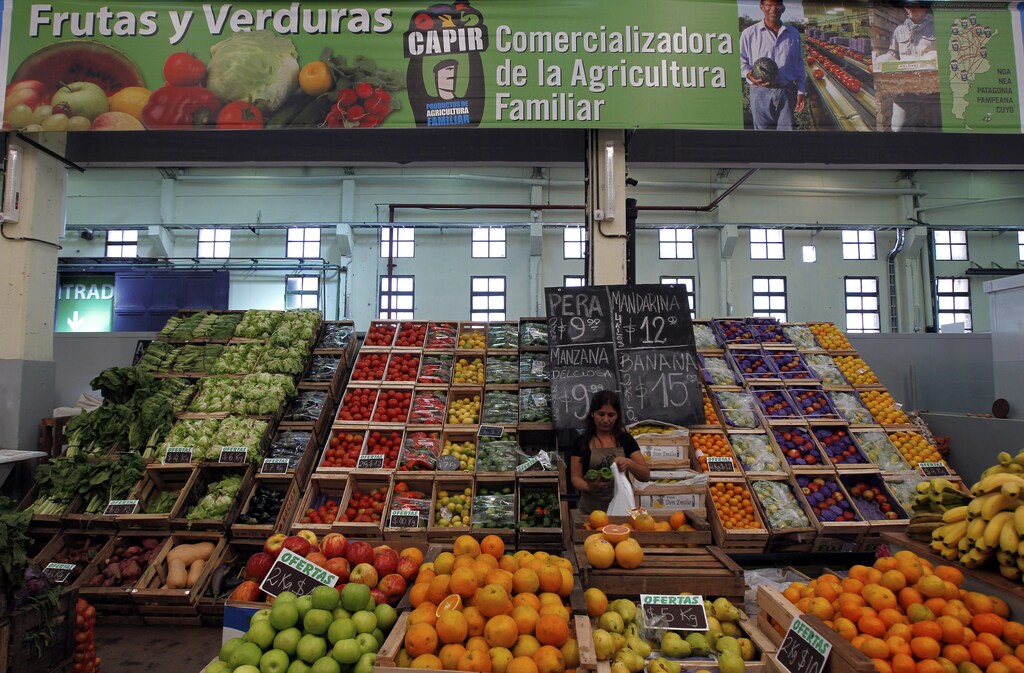 A woman works at a fruit and vegetables stand inside the Mercado Argentino outlet supermarket in Lomas de Zamora, on the outskirts of Buenos Aires, April 22, 2013. Food security across the Latin America and Caribbean region has been hit in recent years.