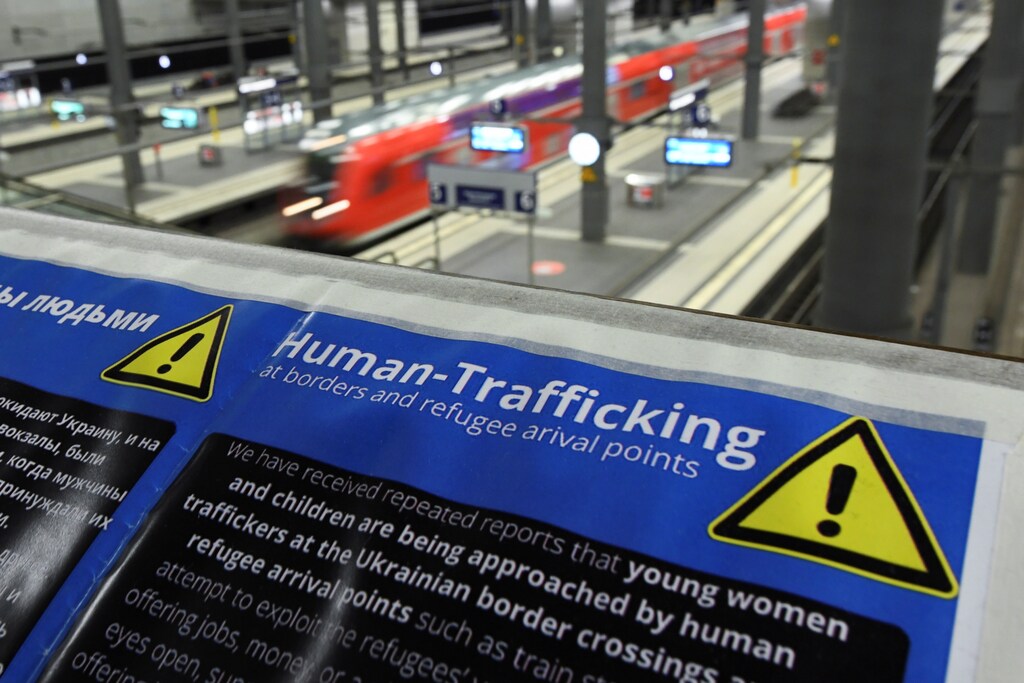 Modern slavery and human trafficking warning at Berlin's central station.