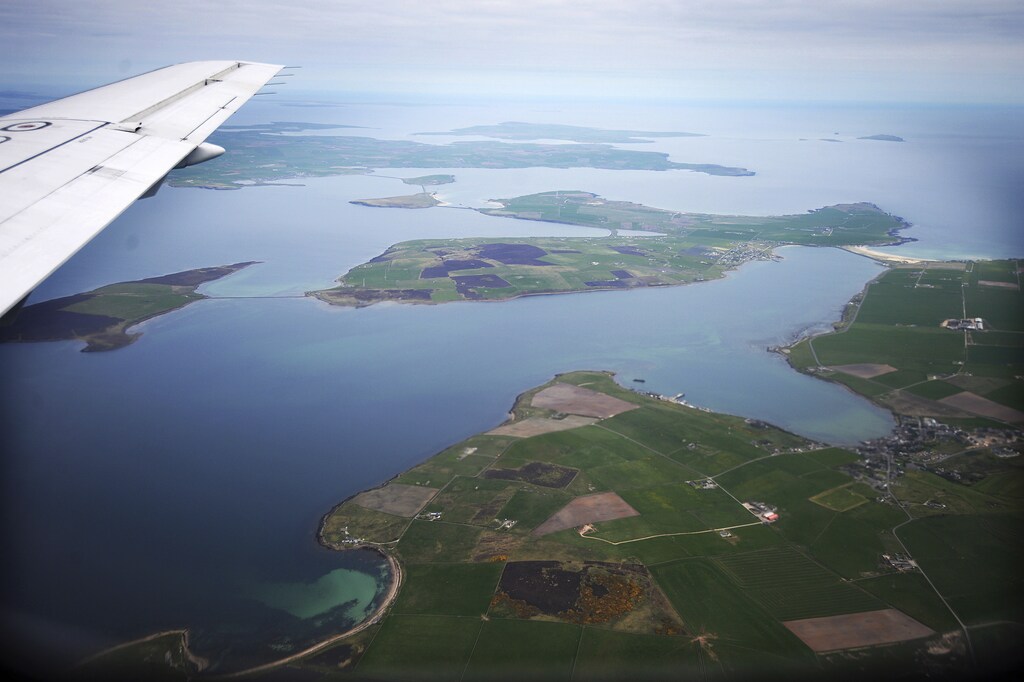 An aerial view of the Orkney Islands, Scotland May 3, 2014. During both World Wars, Scapa Flow was an important British naval base, and the site of significant loss of life. Following the end of World War One, 74 German warships were interned there, and on June 21, 1919 most were deliberately sunk, or scuttled, at the orders of German Rear Admiral Ludwig Von Reuter, who mistakenly thought that the Armistice had broken down and wanted to prevent the British from using the ships. Now Scapa Flow is a popular site for divers, who explore the few wrecks that still remain at the bottom. The year 2014 marks the 100th anniversary of the start of the First World War. Picture taken May 3, 2014. REUTERS/Nigel Roddis (BRITAIN - Tags: CONFLICT ANNIVERSARY ENVIRONMENT SOCIETY MARITIME) ATTENTION EDITORS: PICTURE 01 OF 28 FOR PACKAGE 'WWI - EXPLORING SUNKEN WARSHIPS'TO FIND ALL IMAGES SEARCH 'SCAPA FLOW' - GM1EA6J0S8B01