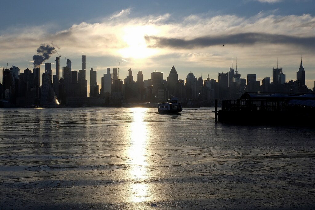 Ice coats the Hudson River as a river ferry departs for New York City from Weehawken, New Jersey, U.S., January 18, 2018. REUTERS/Mike Segar - RC12616116A0
