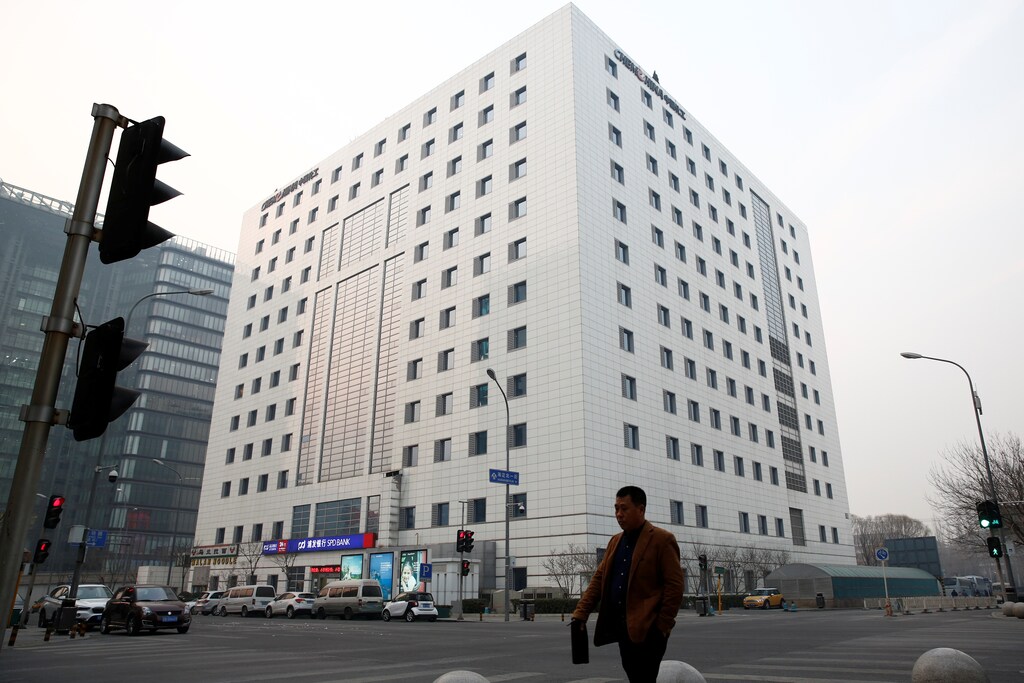A man walks past the headquarters of the China National Chemical Corp, or ChemChina, in Beijing, China February 3, 2017. REUTERS/Thomas Peter - RTX2ZGP6