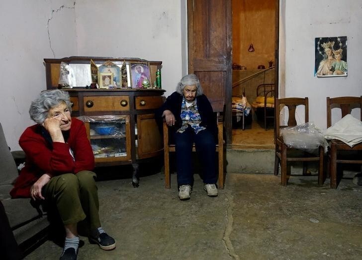 Elderly women rest at their cottage where they were born in Kuluyo, Inquisivi Province in La Paz, Bolivia July 12, 2018. Picture taken July 12, 2018. REUTERS/David Mercado