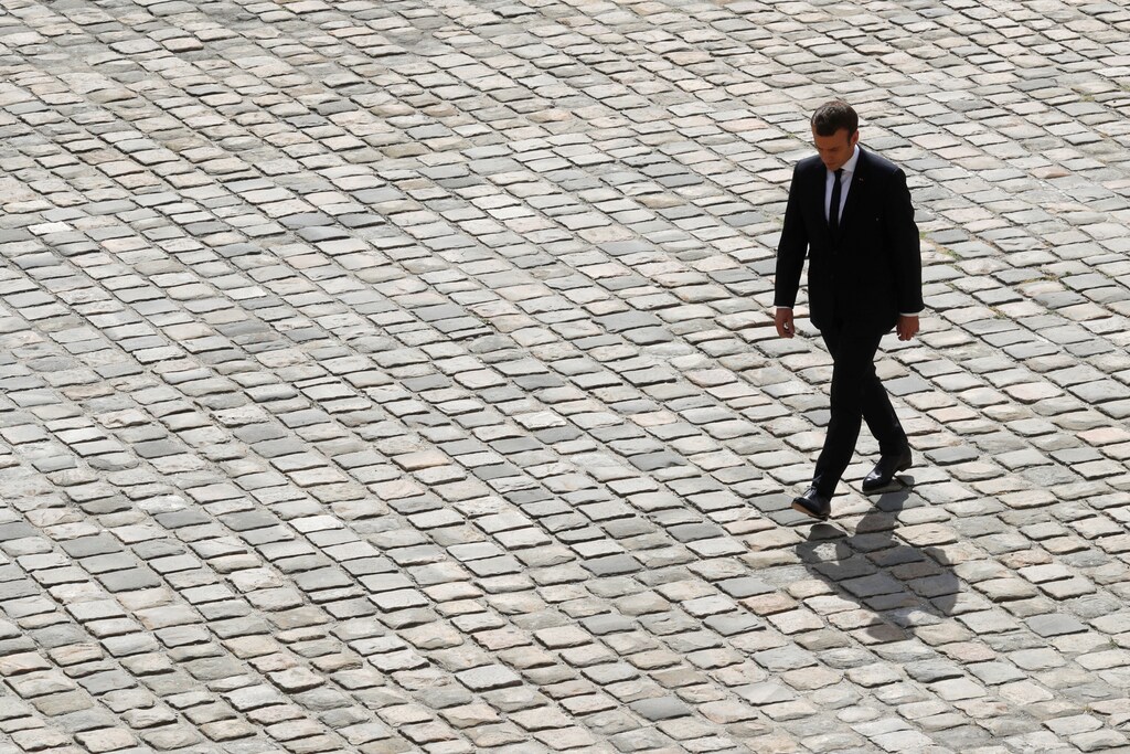 French President Emmanuel Macron walks in the courtyad of the Hotel des Invalides during a national tribute ceremony for late French politician Simone Veil, Holocaust survivor and pro-abortion campaigner, in Paris, France, July 5, 2017. REUTERS/Philippe Wojazer - RTX3A3AB