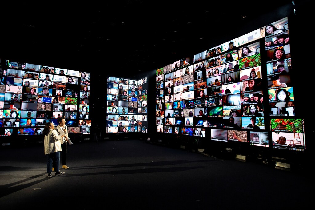 Artists perform in front of screens showing audience via the Zoom application during the first six-hour online music festival at a studio amid the spread of the coronavirus disease (COVID-19) in Bangkok, Thailand, June 7, 2020. REUTERS/Athit Perawongmetha TPX IMAGES OF THE DAY - RC2A4H9WY0SV