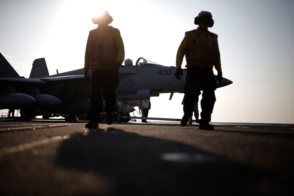 U.S. Navy crew members walk on the deck of the USS Ronald Reagan, a Nimitz-class nuclear-powered super carrier, during a joint naval drill between South Korea and the U.S., in the West Sea, South Korea, October 14, 2016. REUTERS/Kim Hong-Ji - RTSS81O