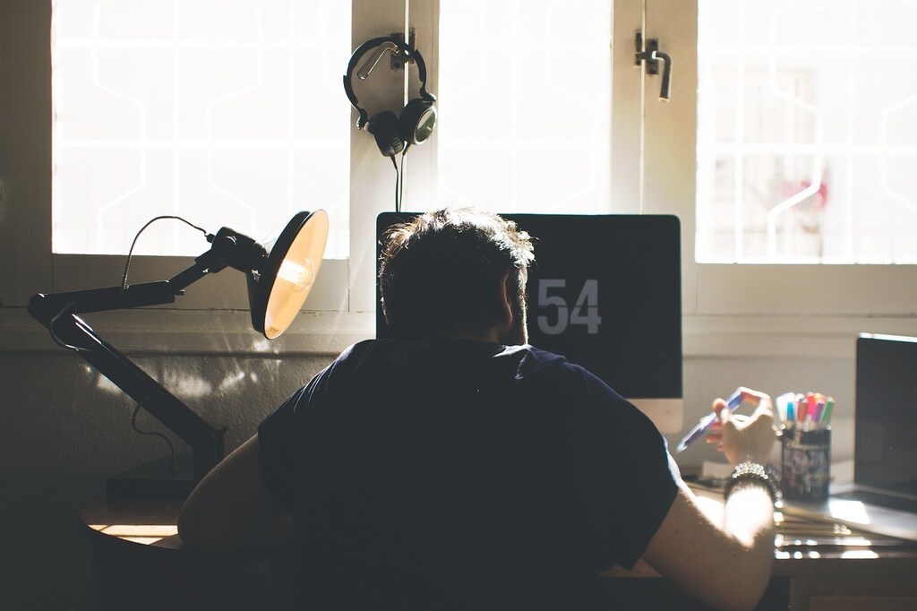 image of a man working from home at his desk