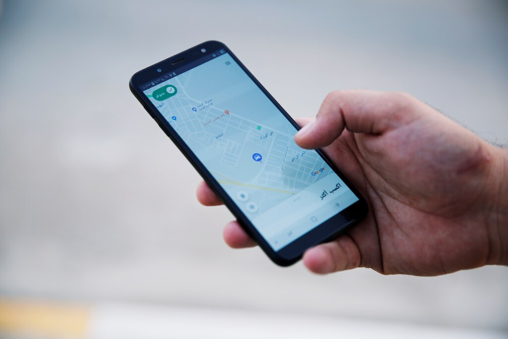 A customer uses Careem application with his smartphone in Mosul, Iraq September 25, 2019. Picture taken September 25, 2019. REUTERS/Abdullah Rashid - RC1C535227A0