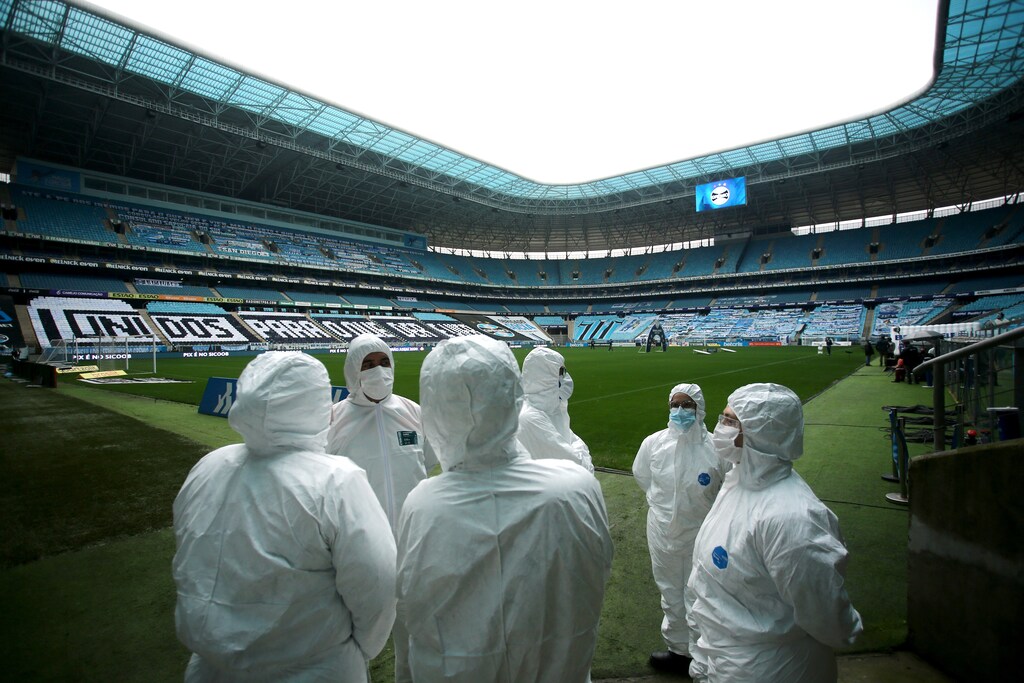 Soccer Football - Brasileiro Championship - Gremio v Fortaleza - Arena do Gremio, Porto Alegre, Brazil - September 13, 2020 General view of staff wearing personal protective equipment (PPE) inside the stadium before the match following the outbreak of the coronavirus disease (COVID-19) REUTERS/Diego Vara TPX IMAGES OF THE DAY - UP1EG9D1EAJ4Y