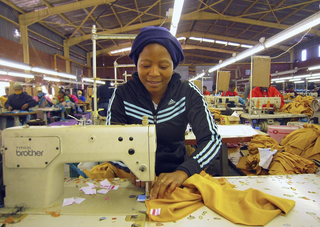 A woman works at a clothing factory at the industrial town of Newcastle, 260 km (162 miles) southeast of Johannesburg May 8, 2013.