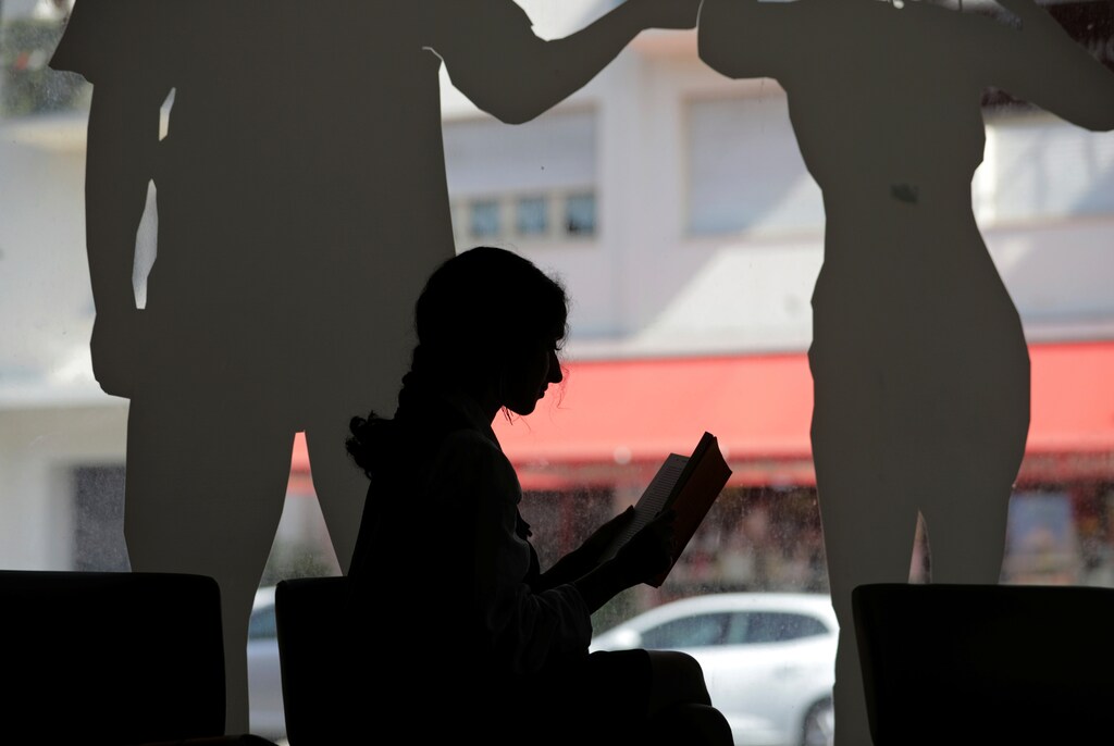 A woman reads a book at the "Louis Nucera" library in Nice, France, September 13, 2018. REUTERS/Eric Gaillard - RC1C10978A50