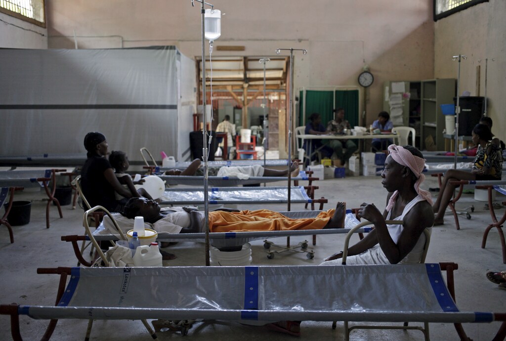 Patients and companions are seen at the Cholera Treatment Center run by the Haitian Ministry of Public Health and Population (MSPP) in collaboration with Doctors Without Borders (MSF) in Port-au-Prince, April 17, 2015. Haitian officials are reporting a spike in cholera cases late last year and carrying over into the first three months of 2015 as an early start to the rainy season has public health workers worried. As of March 28, the Haitian Ministry of Health confirmed at least 11,721 cases of cholera, more than a 300 percent increase from the same period last year. REUTERS/Andres Martinez Casares TPX IMAGES OF THE DAY - GF10000063514