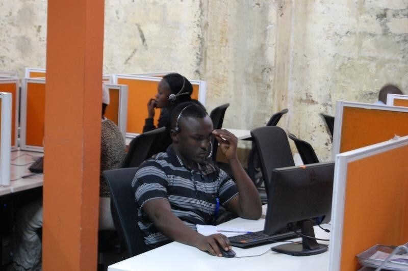 Congolese agents sit in their cubicles as they speak on the phones with their clients, inside the Congo Call Center (CCC) in the Democratic Republic of Congo's capital Kinshasa, July 26, 2016. Picture taken July 26, 2016.