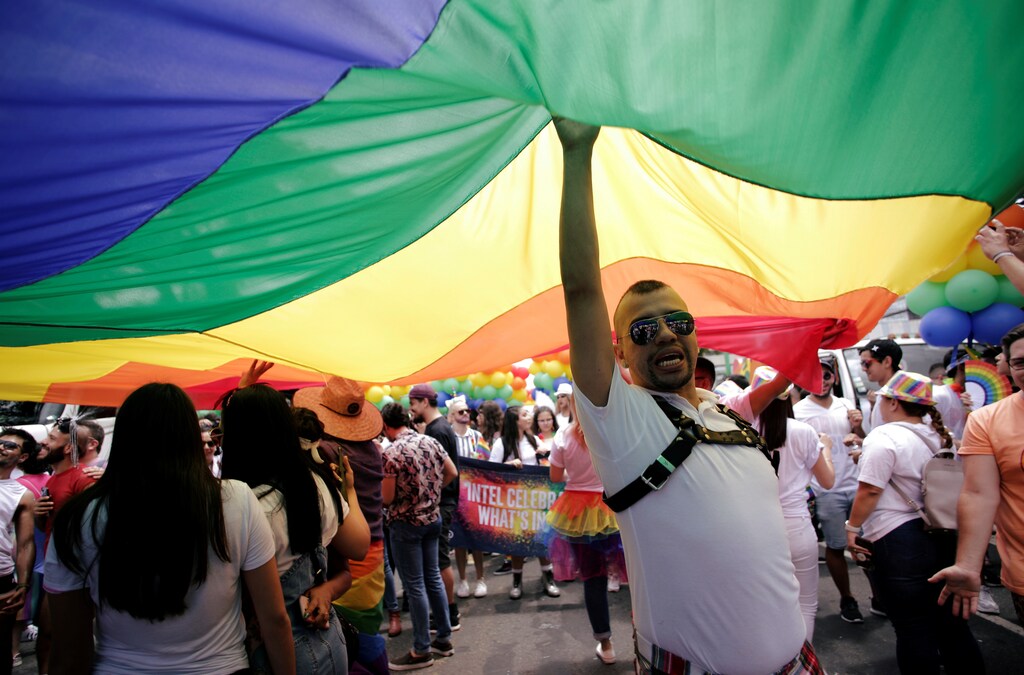 People take part in the annual Gay Pride parade along a Central Avenue, in San Jose, Costa Rica June 23, 2019. REUTERS/Juan Carlos Ulate - RC1DA9D80880