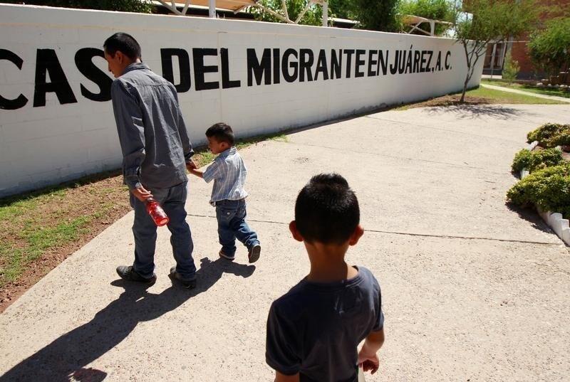 Salvadoran migrant Epigmenio Centeno and his sons, nine-year old Axel Jaret (front) and three-year old Steven Atonay, walk outside the shelter House of the Migrant, after Epigmenio decided to stay with his children in Mexico due to U.S. President Donald Trump's policy that separates immigrant children from their parents, in Ciudad Juarez, Mexico June 19, 2018.
