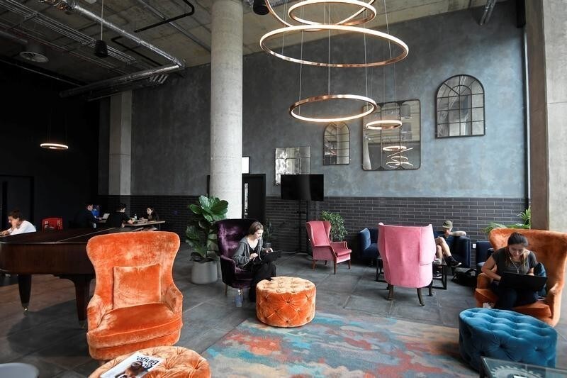 Residents or 'members' work and relax in a shared space at The Collective co-living building in west London, August 14, 2017. Picture taken August 14, 2017. REUTERS/Toby Melville - RC12AAA1E910