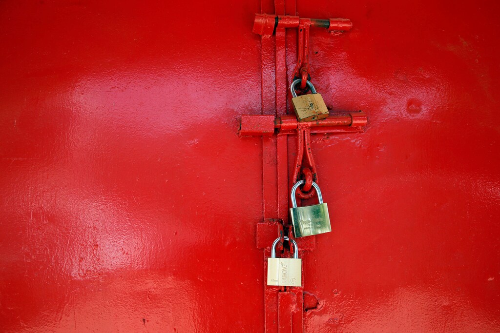 A store door locked with padlocks is seen in Banjul, Gambia January 23, 2017.