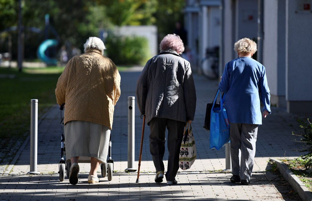 Elderly women walk on a sidewalk in the Pius quarter in Ingolstadt, Germany, October 5, 2018. Picture taken October 5, 2018.