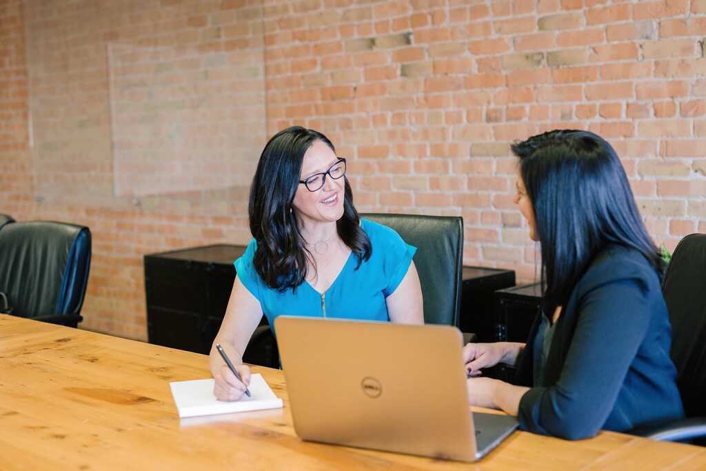 Two businesswomen negotiating.