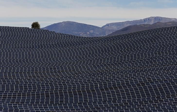 A general view shows solar panels to produce renewable energy at the photovoltaic park in Les Mees, in the department of Alpes-de-Haute-Provence, southern France March 31, 2015. The solar farm of the Colle des Mees, the biggest in France, consists of 112,780 solar modules covering an area of 200 hectares of land and representing 100 MW of power. REUTERS/Jean-Paul Pelissier TPX IMAGES OF THE DAY