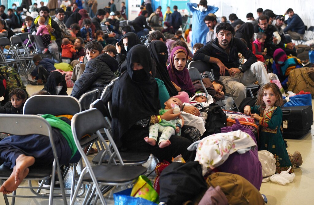 Afghan refugees are processed inside Hangar 5 at Ramstein Air Base in Germany, September 8, 2021. Olivier Douliery/Pool via REUTERS - RC2OLP9XQIQ2