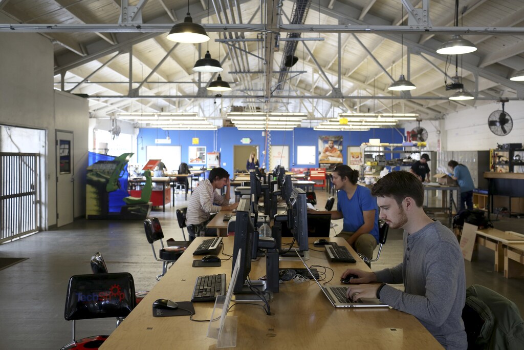 Designers work at computer stations at TechShop in the South of Market neighborhood in San Francisco, California April 24, 2014. In the shadow of Internet monoliths, it's easy to forget that Silicon Valley got its start from hard-scrabble tinkerers building radios, microchips and other devices. Now, a proliferation of high-tech but affordable manufacturing tools and new sources of funding are empowering a generation of handy entrepreneurs and laying the foundation for a hardware renaissance. A growing focus on hardware and the so-called "Maker movement" is sweeping northern California and, in a smaller way, Europe and other countries. Renewed interest in tinkering with objects - versus apps or software - is attracting more money from investors and fostering a growing number of workshops, where aspiring inventors can get their hands on computerized milling machines and other high-end tools. Picture taken April 24, 2014. REUTERS/Robert Galbraith (UNITED STATES - Tags: BUSINESS SCIENCE TECHNOLOGY) - RTR3NZ5R