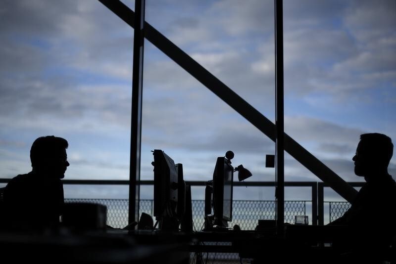 Employees of IT Company CCP work at the company's head office in Reykjavik February 13, 2013. Icelands biggest IT company CCP is what the island needs to leave its economic crisis behind. It is global, growing and employs hundreds but its tale is also one of frustration that echoes concerns about the country's future. Picture taken February 13, 2013. To match Analysis ICELAND-ECONOMY/ REUTERS/Stoyan Nenov (ICELAND - Tags: BUSINESS EMPLOYMENT SOCIETY SCIENCE TECHNOLOGY) - RTR3E2IK