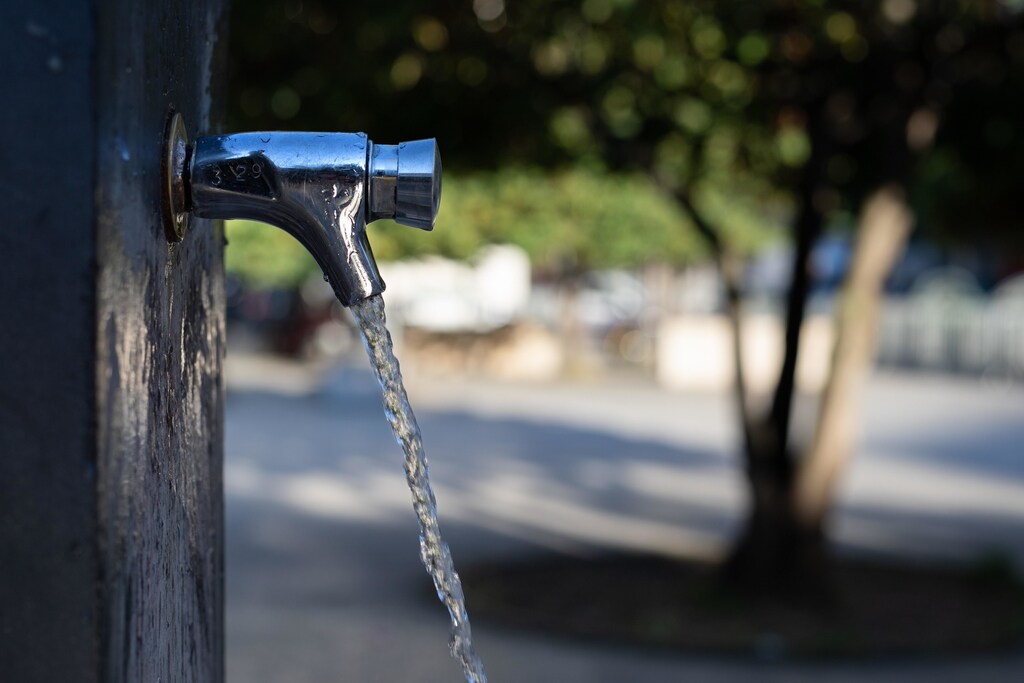 water coming out of a tap at a drinking fountain