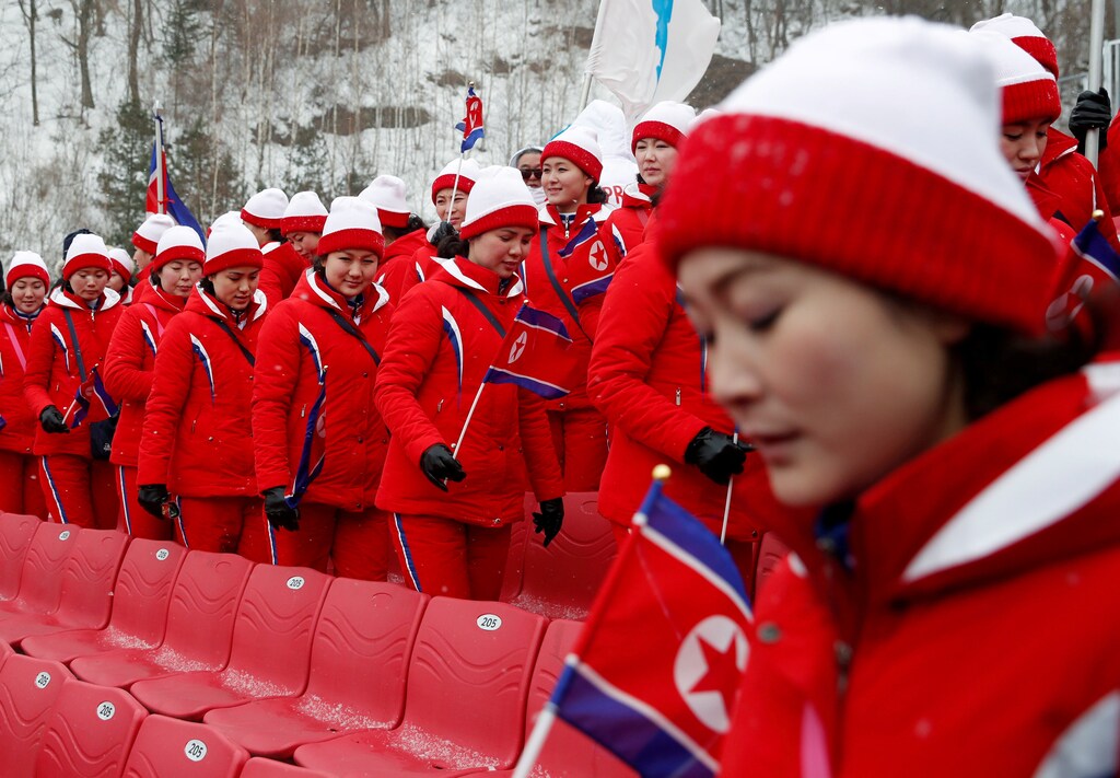 Alpine Skiing Pyeongchang 2018 Winter Olympics Womens Slalom Yongpyong Alpine Centre - Pyeongchang, South Korea February 14, 2018 - North Korean cheerleaders react. REUTERS/Mike Segar SEARCH "OLYMPICS BEST" FOR ALL PICTURES. TPX IMAGES OF THE DAY. - RC16AE03A240
