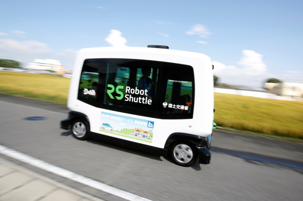 Robot Shuttle, a driver-less, self driving bus, using software developed by Japan's internet commerce and mobile games provider DeNA Co., drives past during an experimental trial with a self-driving bus in a community in Nishikata town, Tochigi Prefecture, Japan September 8, 2017. Picture taken September 8, 2017. REUTERS/Issei Kato - RC19071C1600