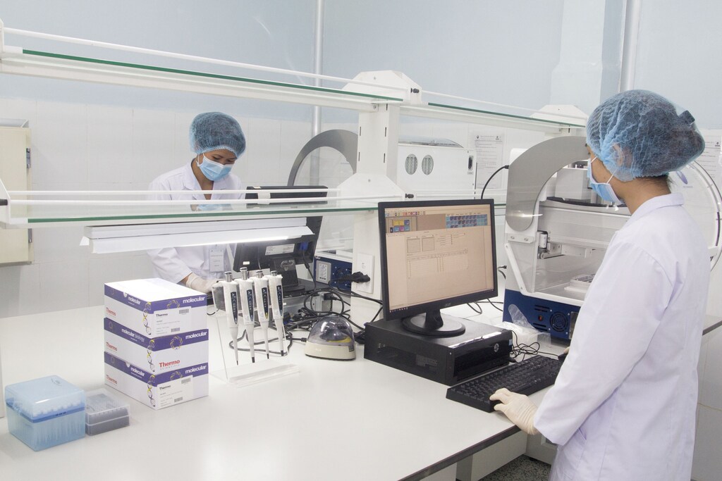 Employees of Viet A corp work inside a lab of their factory in Binh Duong province, Vietnam in this handout picture taken July 31, 2019. Viet A Corp/Handout via REUTERS ATTENTION EDITORS - THIS IMAGE HAS BEEN SUPPLIED BY A THIRD PARTY - RC2KEG92U2OY