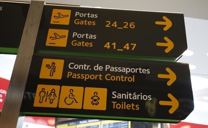 Gates, passport control and toilets signs are seen at Lisbon's airport, Portugal June 24, 2016. REUTERS/Rafael Marchante