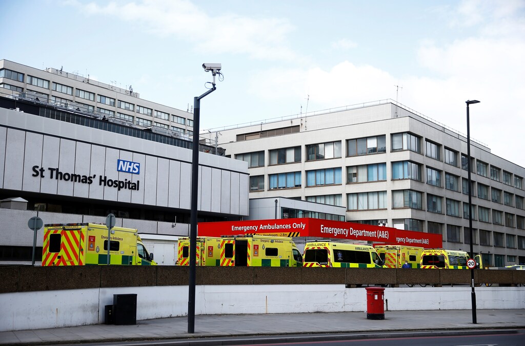 Ambulances are seen outside St Thomas' hospital, as the spread of the coronavirus disease (COVID-19) continues, London, Britain, March 29, 2020. REUTERS/Henry Nicholls - RC2QTF97DLS8