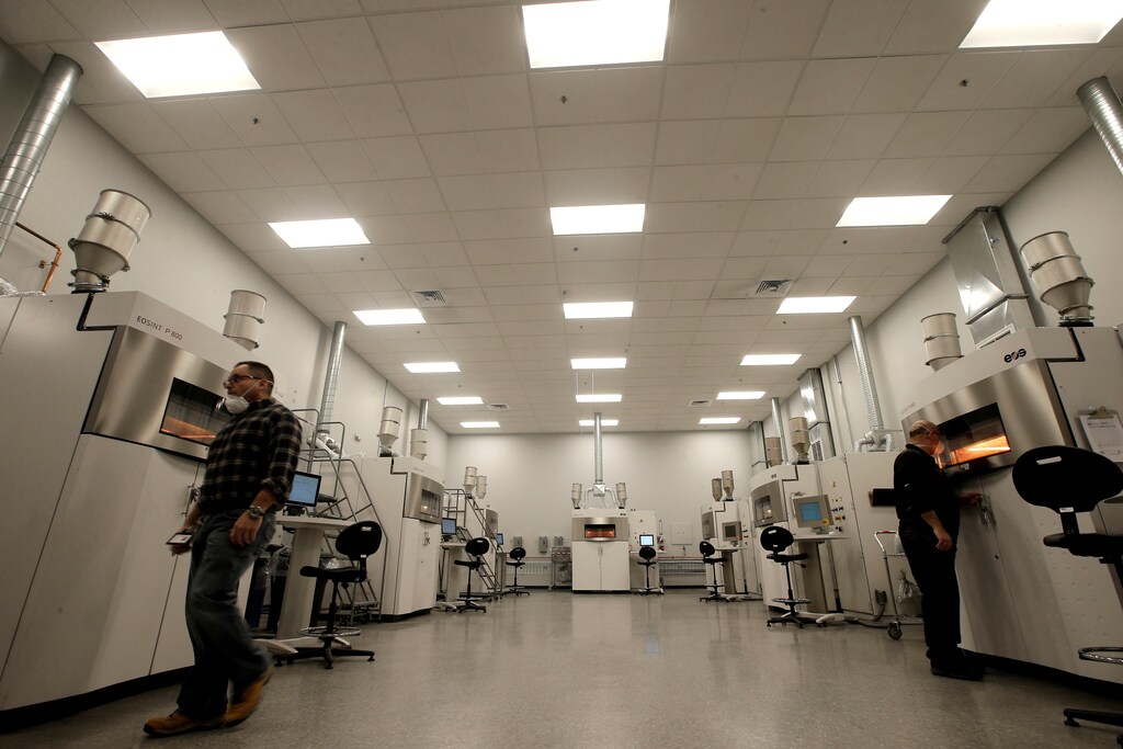 Machine technicians work with EOS 3-D printer units as they build thermoplastic parts from "OXPEKK" material in the Laser Melting Room at Oxford Performance Materials Inc., the maker of more than 600 parts to be used on Boeing's new Starliner manned spacecraft, in South Windsor, Connecticut, U.S., January 31, 2017. Picture taken January 31,2017. REUTERS/Mike Segar