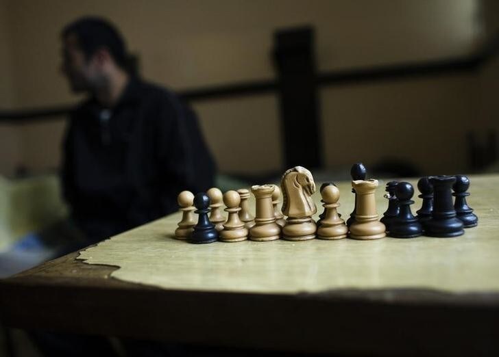 An illegal immigrant sits next to a chess table at the Padinska Skela detention facility in Belgrade May 20, 2010. Serbia has stepped up efforts to patrol the border as a condition of making progress in its own goal of gaining EU membership. Last year, Brussels granted Serbian citizens visa-free travel after Belgrade promised to crack down on crime and improve control of hitherto porous borders. Picture taken May 20, 2010. To match Feature SERBIA-EU/BORDER REUTERS/Marko Djurica (SERBIA - Tags: SOCIETY POLITICS)