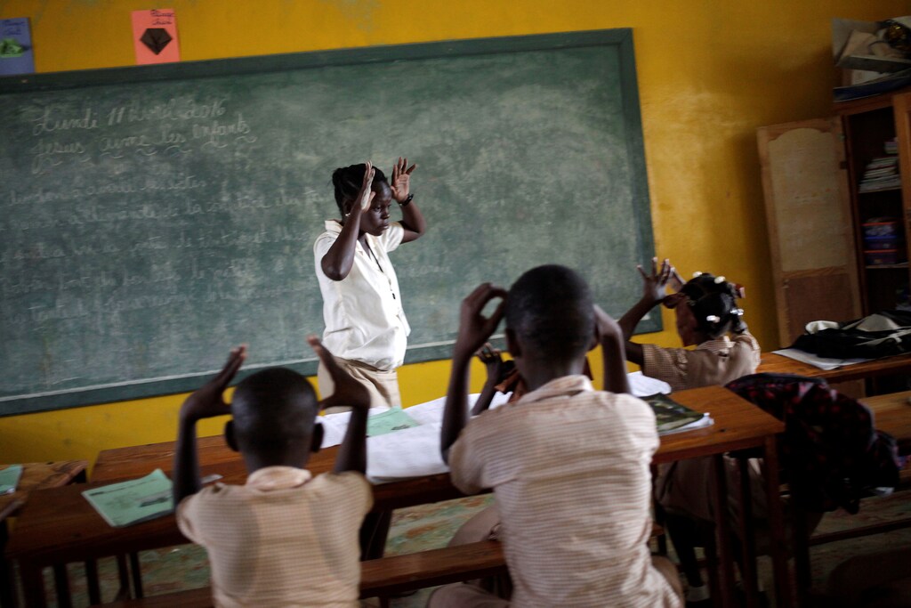 A teacher teaches Creole sign language to pupils at the Mission de L'Espoir school in Leveque, Haiti, April 11, 2016. REUTERS/Andres Martinez Casares SEARCH "DEAF HAITI" FOR THIS STORY. SEARCH "WIDER IMAGE" FOR ALL STORIES. - RTX2NWKC