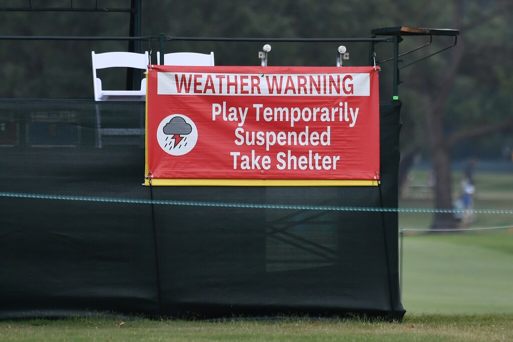 A sign showing a weather warning during suspended play during the second round of the U.S. Women's Open golf tournament at Country Club of Charleston. Mandatory Credit: Jasen Vinlove-USA TODAY Sports