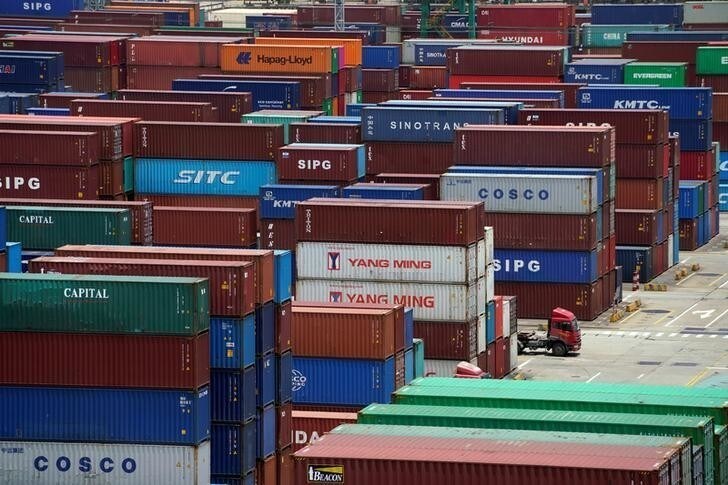 Shipping containers are seen at a port in Shanghai, China July 10, 2018. REUTERS/Aly Song
