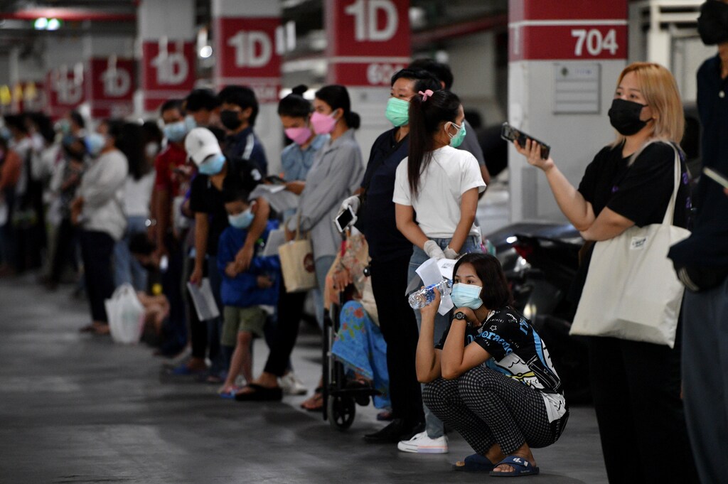 People queue for free coronavirus disease (COVID-19) rapid antigen tests at a mass testing station, as the spread of COVID-19 continues, in Bangkok, Thailand, July 15, 2021. REUTERS/Chalinee Thirasupa - RC2WKO9R80TA