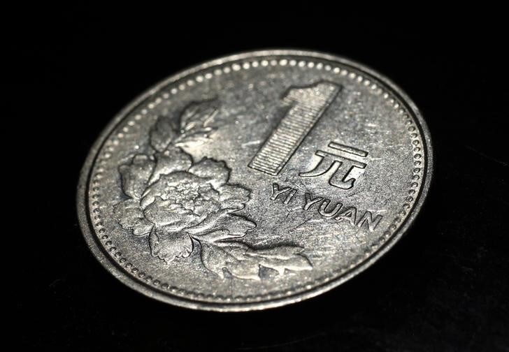 A Chinese one yuan coin is seen in this picture illustration taken in Beijing May 12, 2013. Investors convinced China's currency is once again a one-way bet upward should think again: signs of slowing economic growth could cut short the yuan's rally. Picture taken May 12. To match Analysis CHINA-YUAN/SPECULATION REUTERS/Petar Kujundzic (CHINA - Tags: BUSINESS)