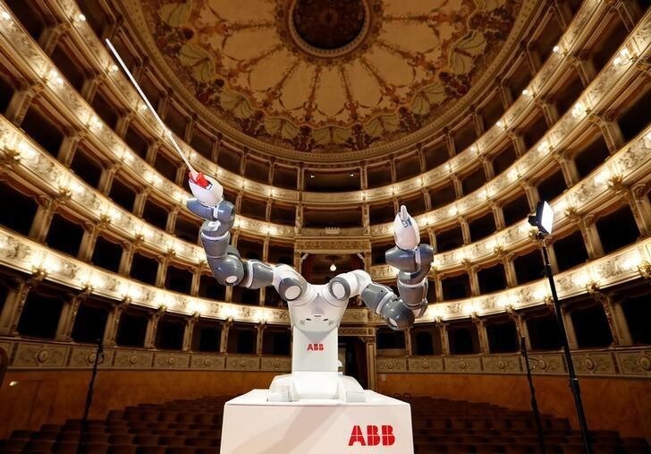 Humanoid robot YuMi is seen during the rehearsal at the Verdi Theatre in Pisa, Italy September 12, 2017. YuMi will conduct the Lucca Philharmonic Orchestra, performing a concert alongside Italian tenor Andrea Bocelli (not pictured). REUTERS/Remo Casilli